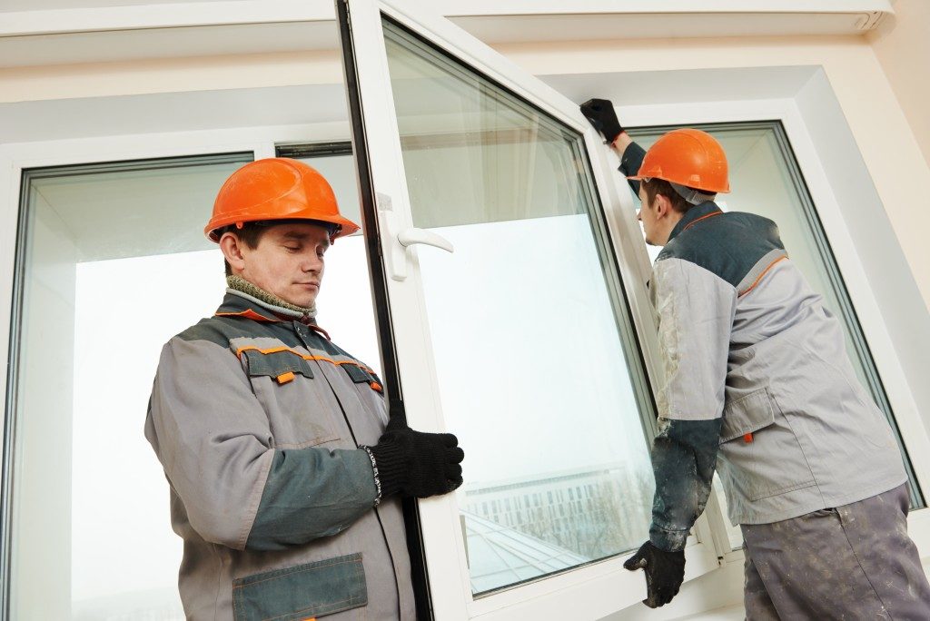 workers replacing windows