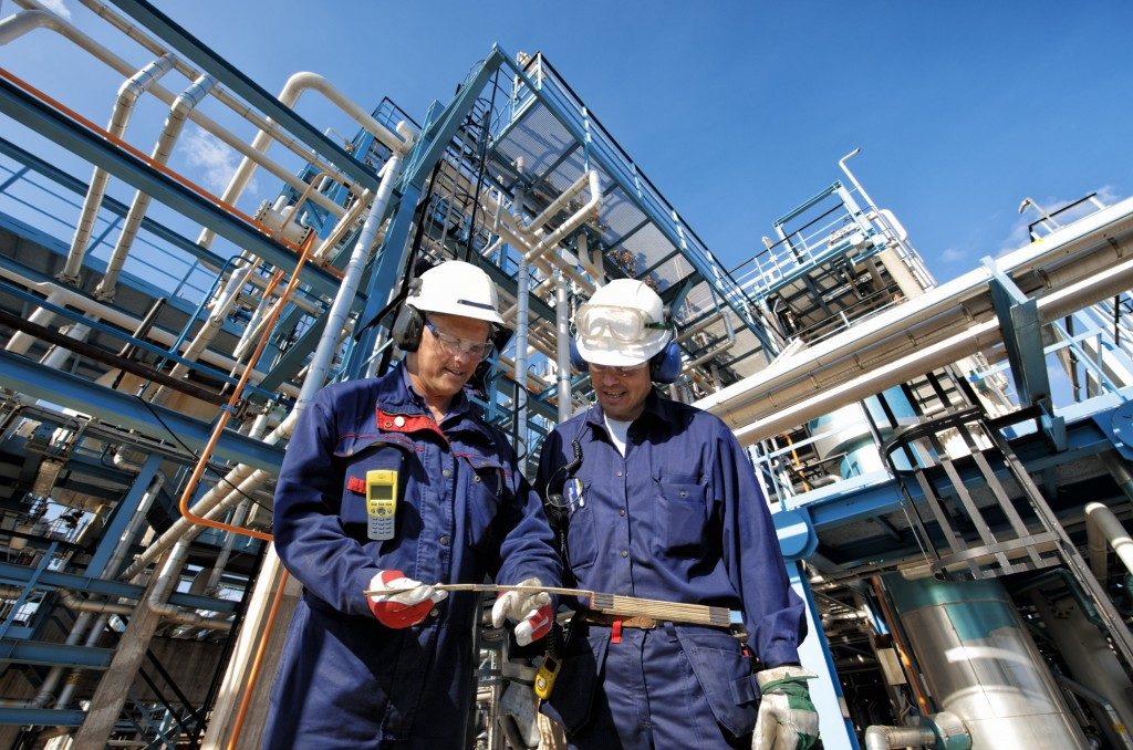 two workers in an oil industry