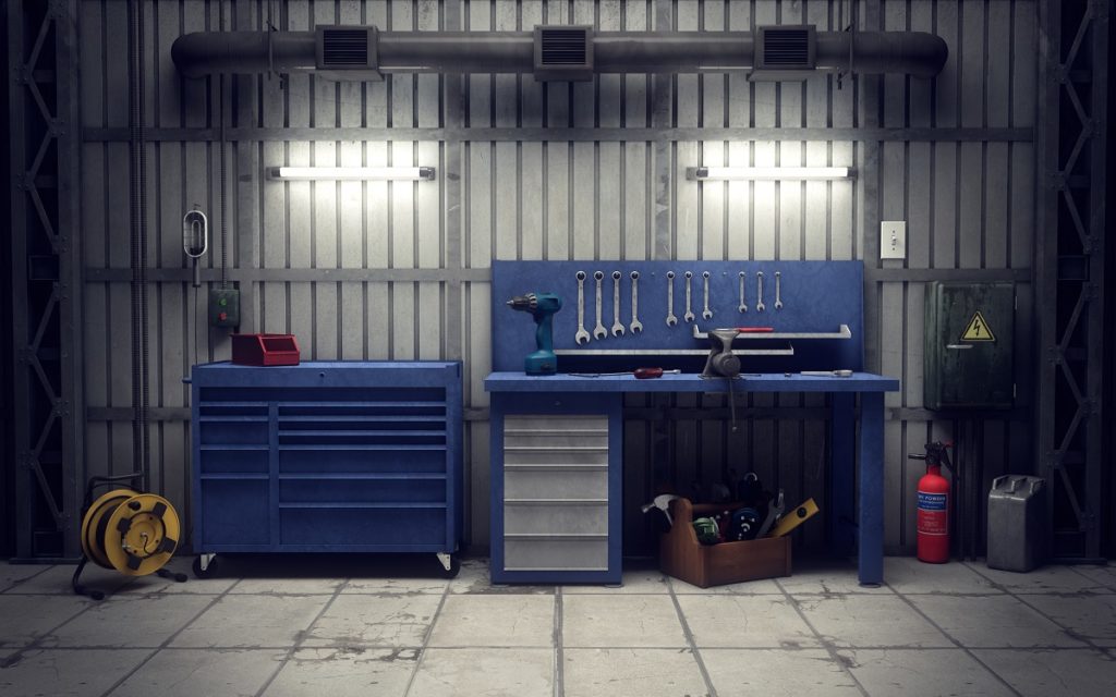garage space with blue cabinets and tools