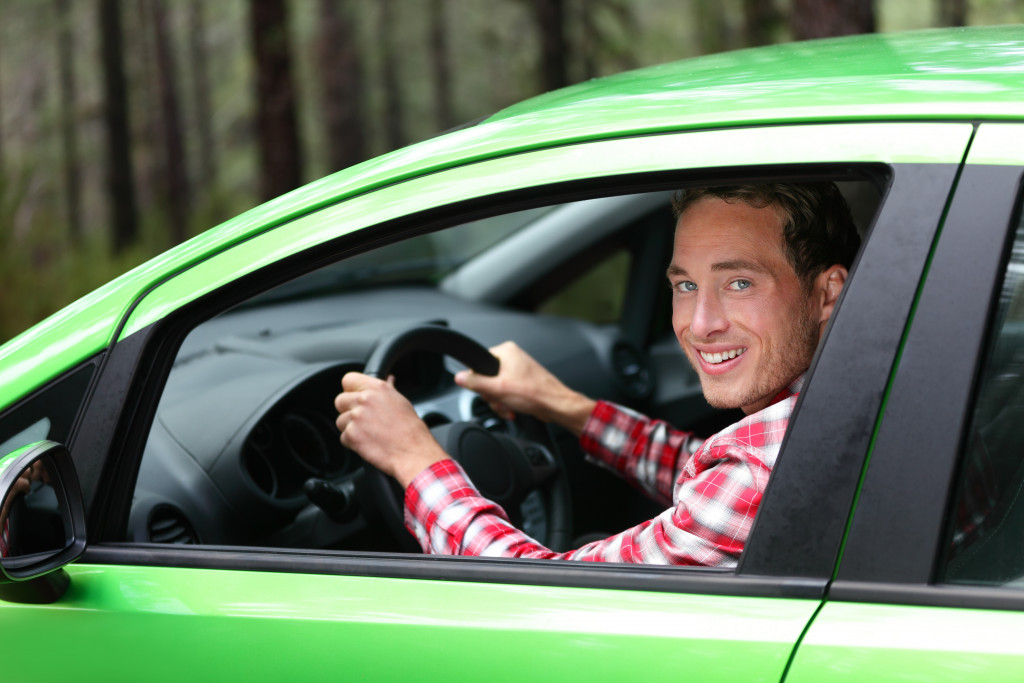 Man inside a green car