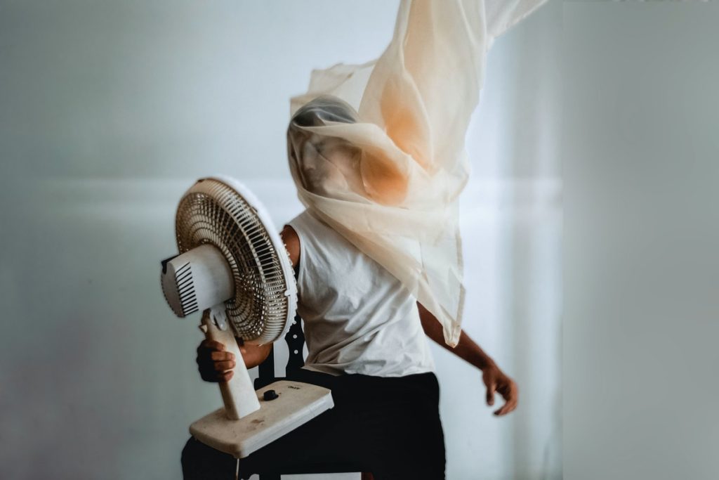 person holding a fan